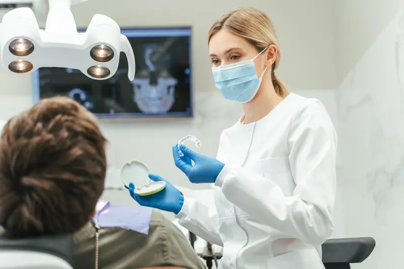 Dentist discussing oral care with a patient