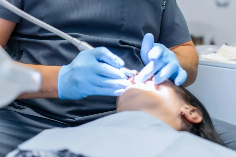 Dentist providing treatment to a patient