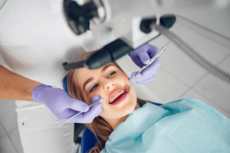 Patient smiling during a dental examination